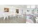 Bright sunroom with tile floors, white furniture and plenty of natural light at 13632 Clara Ln, Port Charlotte, FL 33981