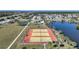 Community tennis courts close to lake providing picturesque recreational opportunity for residents at 13632 Clara Ln, Port Charlotte, FL 33981
