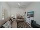 Cozy living room features leather sofa, entertainment center and a soft patterned rug at 1420 Winding Oak Dr, Port Charlotte, FL 33948