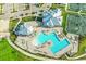 Aerial view of the pool, with surrounding deck chairs and umbrellas at 14234 Heritage Landing Blvd # 1016, Punta Gorda, FL 33955