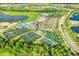 Aerial view featuring the community's amenities, including tennis courts and swimming pool at 14234 Heritage Landing Blvd # 1016, Punta Gorda, FL 33955
