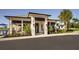 Stunning clubhouse exterior featuring elegant architectural details, lush landscaping, and convenient parking in a golf community at 14234 Heritage Landing Blvd # 1016, Punta Gorda, FL 33955
