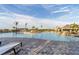 Expansive community pool with a center island, loungers, and shaded cabanas at 14234 Heritage Landing Blvd # 1016, Punta Gorda, FL 33955