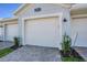 Exterior shot featuring the garage of this home with brick pavers at 14234 Heritage Landing Blvd # 1016, Punta Gorda, FL 33955