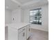 Modern kitchen island featuring white cabinets and drawers, overlooking a window at 14234 Heritage Landing Blvd # 1016, Punta Gorda, FL 33955