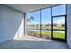 A screened lanai boasts tranquil views of a pond, palm tree, and lush landscaping at 14234 Heritage Landing Blvd # 1016, Punta Gorda, FL 33955