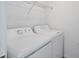 Bright laundry room with white appliances at 14234 Heritage Landing Blvd # 1016, Punta Gorda, FL 33955