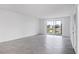 Inviting living room featuring tile floors, an outdoor view, and sliding glass doors at 14234 Heritage Landing Blvd # 1016, Punta Gorda, FL 33955
