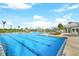 Expansive pool featuring clear blue water and plenty of seating with shaded areas at 14234 Heritage Landing Blvd # 1016, Punta Gorda, FL 33955