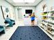 Chic reception area with light walls, stylish seating, and retail display shelves at 14234 Heritage Landing Blvd # 1016, Punta Gorda, FL 33955