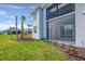 Backyard view of screened lanai and lush landscaping, with a view of the home's exterior and surrounding greenery at 14234 Heritage Landing Blvd # 1016, Punta Gorda, FL 33955