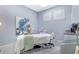 Relaxing spa room with a massage table, serene decor, and natural lighting for a peaceful ambiance at 14234 Heritage Landing Blvd # 1016, Punta Gorda, FL 33955