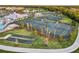Aerial view of the Heritage Landing sports complex, showcasing the tennis and bocce ball courts at 14234 Heritage Landing Blvd # 1016, Punta Gorda, FL 33955