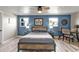 Comfortable bedroom featuring a modern bed, dual windows, and a stylish accent wall for a relaxing atmosphere at 155 Francis Ne Dr, Port Charlotte, FL 33952