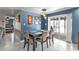 Dining room features a dark wood table, views of the bedroom and patio at 155 Francis Ne Dr, Port Charlotte, FL 33952