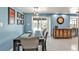 Dining room with modern table set, light blue walls, and pool view at 155 Francis Ne Dr, Port Charlotte, FL 33952