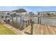 Functional wooden dock with a boat lift and a convenient fish cleaning station for enjoying waterfront activities at 155 Francis Ne Dr, Port Charlotte, FL 33952