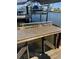 Close-up view of the fish cleaning station on the dock, featuring running water for easy cleaning at 155 Francis Ne Dr, Port Charlotte, FL 33952