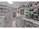 Functional laundry room with shelves, modern washer, dryer, and convenient outdoor access at 155 Francis Ne Dr, Port Charlotte, FL 33952