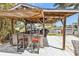 Outdoor bar featuring seating and grill with canal views, perfect for hosting summer barbecues and social gatherings at 155 Francis Ne Dr, Port Charlotte, FL 33952
