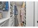 Well-organized walk-in closet featuring shelving and hanging storage solutions for optimal space and organization at 155 Francis Ne Dr, Port Charlotte, FL 33952