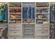 Spacious walk-in closet featuring shelving, drawers and ample storage space for clothes and accessories at 155 Francis Ne Dr, Port Charlotte, FL 33952