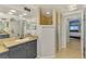 Bathroom vanity featuring granite counters, dark cabinets, and a step-in shower at 1563 Arundel Ave, North Port, FL 34288