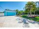 Bright blue home with two car garage and inviting curb appeal at 1563 Arundel Ave, North Port, FL 34288