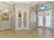 Spacious foyer with decorative art niche and an arched window above the entry door at 1563 Arundel Ave, North Port, FL 34288