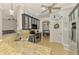 Bright kitchen with stainless steel appliances, stylish cabinetry, granite countertops, and a view into the living room at 1563 Arundel Ave, North Port, FL 34288