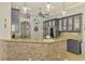 Beautiful kitchen featuring granite countertops, modern cabinetry, stainless steel appliances, and an open design at 1563 Arundel Ave, North Port, FL 34288