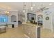 Open kitchen with granite countertops, stone backsplash, and adjacent living spaces at 1563 Arundel Ave, North Port, FL 34288
