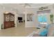 Open living room area featuring tile floors, neutral paint, and backyard views at 1563 Arundel Ave, North Port, FL 34288