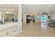 Open-concept living room featuring tile floors and ample space for entertaining and relaxation at 1563 Arundel Ave, North Port, FL 34288