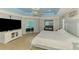 A main bedroom with a light-blue ceiling, with a view of the backyard pool from the doorway at 1563 Arundel Ave, North Port, FL 34288