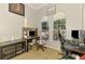 Office space featuring large windows, tiled floors, and contemporary furnishings at 1563 Arundel Ave, North Port, FL 34288