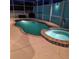 Backyard pool with an in-ground jacuzzi and plenty of space for relaxing and entertaining at 1563 Arundel Ave, North Port, FL 34288