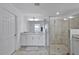 Modern bathroom with a walk-in shower, granite countertop, tile floor, and double sink vanity at 15951 Grassland Ln # 3812, Punta Gorda, FL 33982
