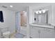 Bathroom featuring a tub/shower combination with a vanity, mirror, and granite countertop at 15951 Grassland Ln # 3812, Punta Gorda, FL 33982