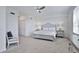 Bright bedroom with a ceiling fan, carpeted floor, walk-in closet, and neutral decor at 15951 Grassland Ln # 3812, Punta Gorda, FL 33982