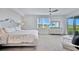 Bright bedroom with a ceiling fan, lanai access, carpeted floor, and neutral decor at 15951 Grassland Ln # 3812, Punta Gorda, FL 33982
