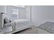 Bright bedroom with a window, neutral decor, ceiling fan, carpeted floor, and closet at 15951 Grassland Ln # 3812, Punta Gorda, FL 33982