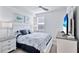 Cozy bedroom with a window, neutral decor, ceiling fan, and carpeted flooring at 15951 Grassland Ln # 3812, Punta Gorda, FL 33982