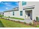 Inviting two-story home with manicured lawn and tasteful landscaping, offering curb appeal and a welcoming entrance at 15951 Grassland Ln # 3812, Punta Gorda, FL 33982