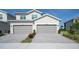 Charming two-story home with two-car garage and well-maintained driveway and manicured landscaping at 15951 Grassland Ln # 3812, Punta Gorda, FL 33982