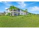Exterior view of the home featuring a screened lanai on the ground floor at 15951 Grassland Ln # 3812, Punta Gorda, FL 33982
