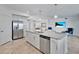 Open-concept kitchen with granite counters, stainless appliances, and seamless access to dining and living area at 15951 Grassland Ln # 3812, Punta Gorda, FL 33982