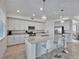 Modern kitchen with a large island, granite countertops, and stainless steel appliances, perfect for entertaining at 15951 Grassland Ln # 3812, Punta Gorda, FL 33982