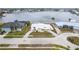 Waterfront home with a circular driveway and nicely landscaped yard, perfect for enjoying the views at 168 Morgan Se Ln, Port Charlotte, FL 33952