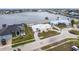 Lovely waterfront home with a well-manicured lawn, circular driveway, and stunning views at 168 Morgan Se Ln, Port Charlotte, FL 33952